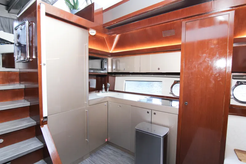 Slide: The Image of Luxurious kitchen interior of 2009 Riva 68' EGO SUPER yacht with modern cabinetry. - 26