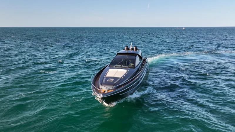 Slide: The Image of 2009 Riva 68' EGO SUPER yacht cruising on open sea under clear sky. - 3