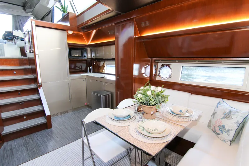 Slide: The Image of Luxurious interior of 2009 Riva 68' EGO SUPER yacht with elegant dining area and modern kitchen. - 31