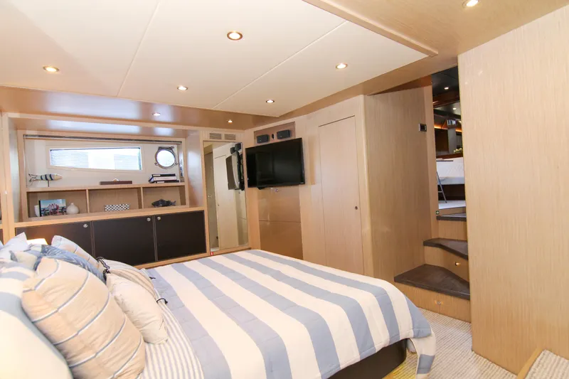 Slide: The Image of Luxurious bedroom interior of 2009 Riva 68' EGO SUPER yacht with striped bedding. - 34