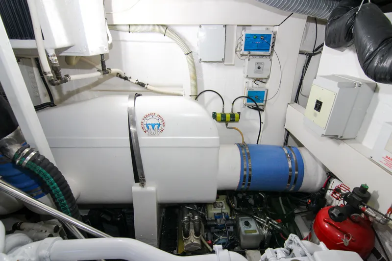 Slide: The Image of Engine room of 2009 Riva 68' EGO SUPER yacht, featuring mechanical equipment and control panels. - 46