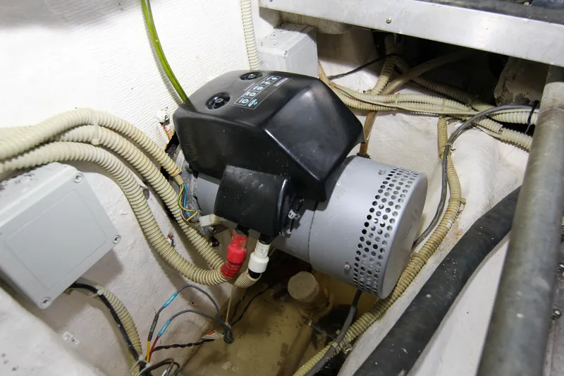 Slide: The Image of Engine room of 2009 Riva 68' EGO SUPER yacht, featuring mechanical components and wiring. - 52