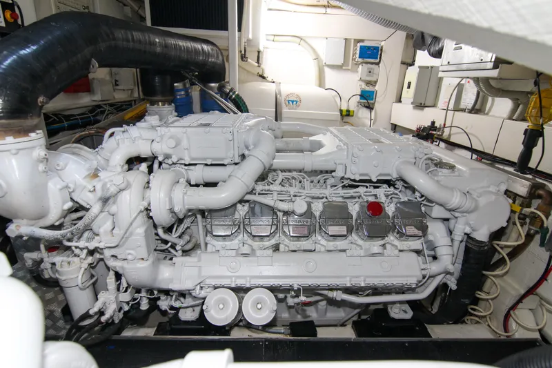 Slide: The Image of Engine room of 2009 Riva 68' EGO SUPER yacht, showcasing a powerful marine engine. - 64