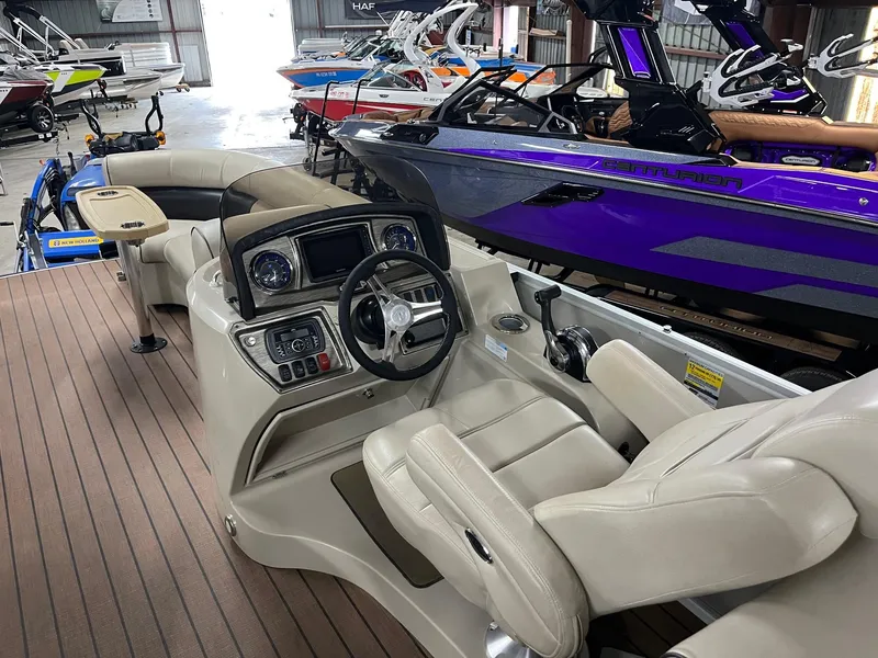 Slide: The Image of Interior of a 2019 Premier 250 Solaris boat with luxurious seating and modern dashboard. - 10