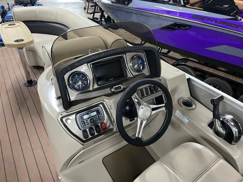 Slide: The Image of 2019 Premier 250 Solaris boat dashboard with steering wheel and control panel. - 11