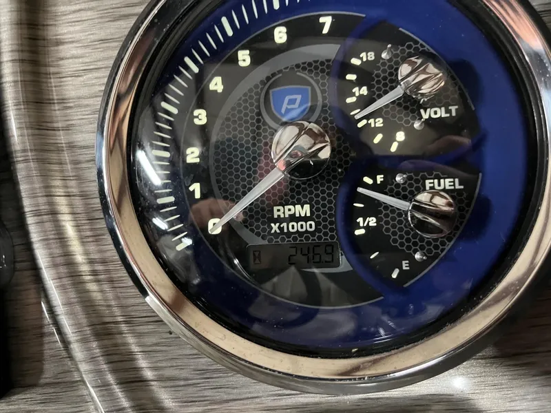 Slide: The Image of Premier 250 Solaris 2019 dashboard showing RPM, voltage, and fuel gauges. - 12