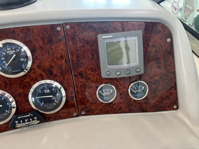 Slide: The Image of Dashboard of 2005 Formula 400 SS boat with gauges and Raymarine display. - 12