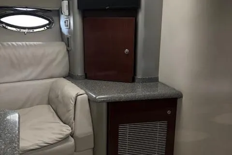 Slide: The Image of Interior of 2005 Formula 400 SS boat with leather seating and wooden cabinetry. - 15