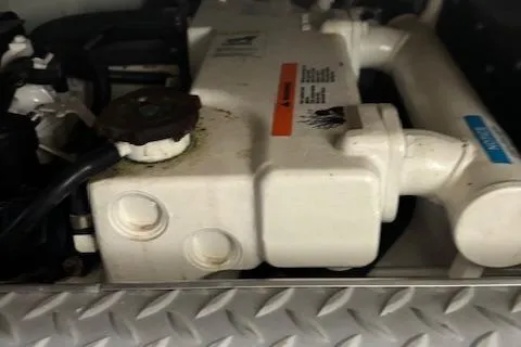 Slide: The Image of Engine component of a 2005 Formula 400 SS boat, featuring metal and plastic parts. - 5