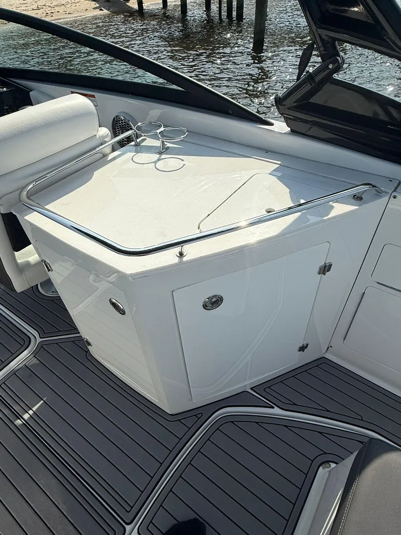 Slide: The Image of 2023 Monterey M65 boat interior with sleek white cabinetry and modern design. - 15