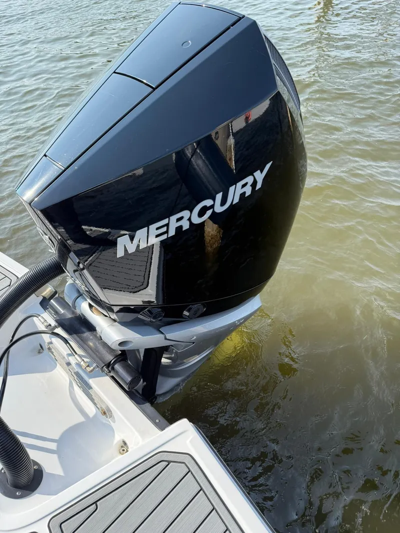 Slide: The Image of 2023 Monterey M65 boat with Mercury outboard motor on water. - 7