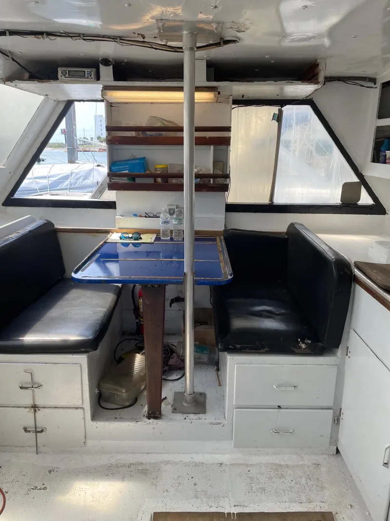 Slide: The Image of Interior of 1983 Commercial Hull #1 Key West boat with seating and table. - 11