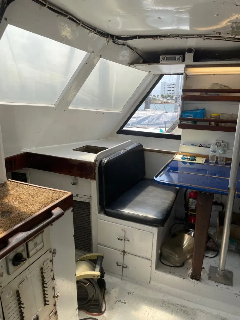 Slide: The Image of Interior of 1983 Commercial Hull #1 Key West boat with seating and storage. - 13