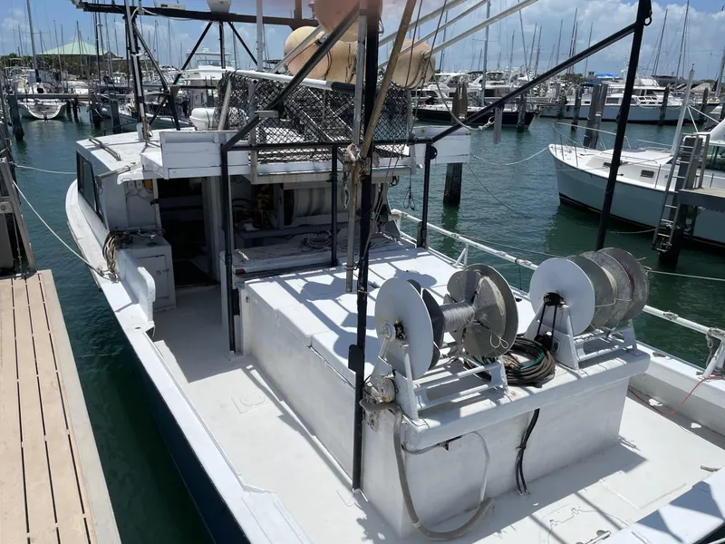 Slide: The Image of Commercial fishing boat docked at marina, 1983 Hull #1 Key West model. - 16