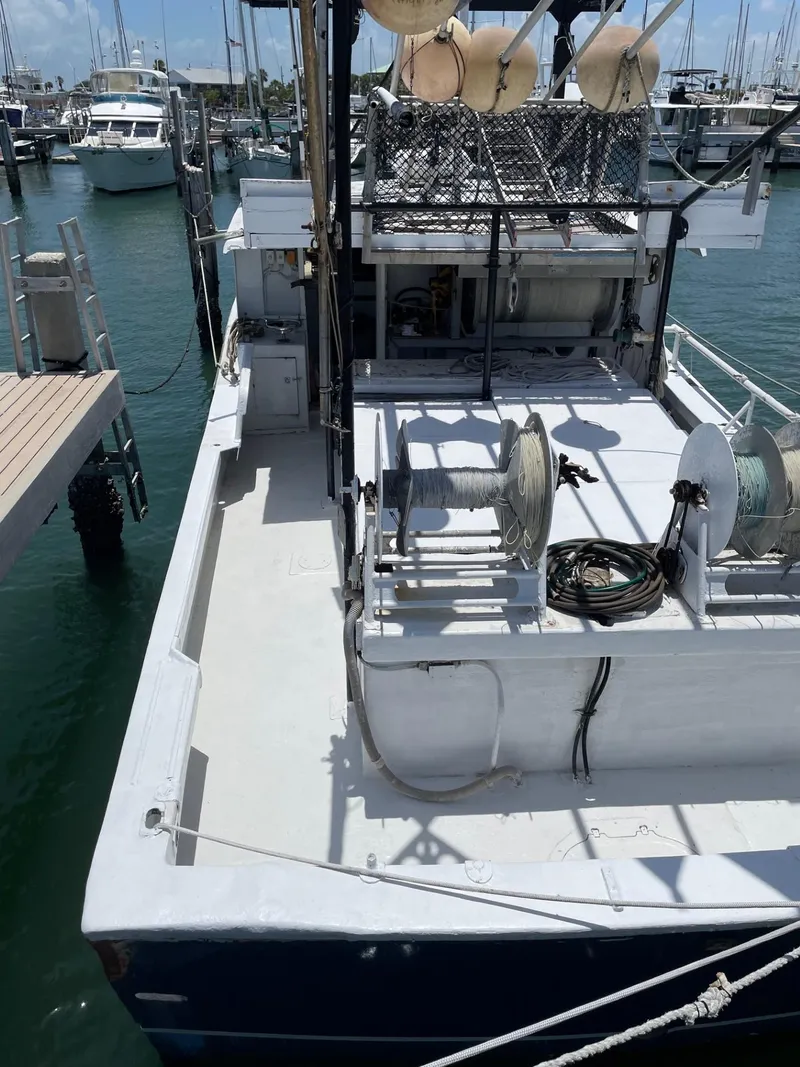 Slide: The Image of Commercial fishing boat docked at marina, 1983 Hull #1 Key West model. - 17