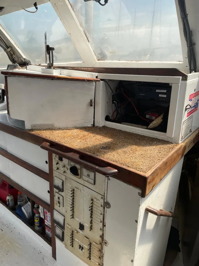Slide: The Image of 1983 Commercial Hull #1 Key West boat interior with control panel and storage compartments. - 5