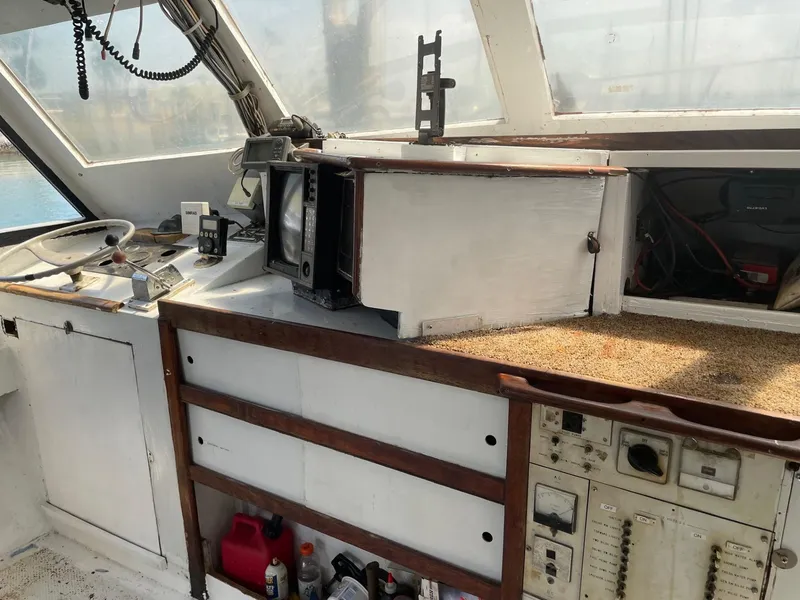 Slide: The Image of Interior of 1983 Commercial Hull #1 Key West boat with navigation equipment and control panel. - 8