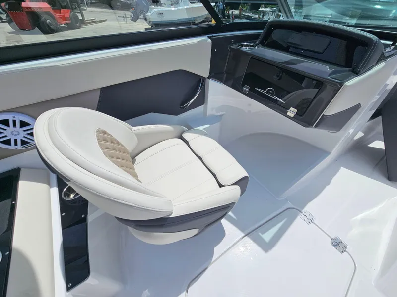 Slide: The Image of Luxurious interior of 2025 Monterey M-225 boat with plush seating and modern dashboard. - 13