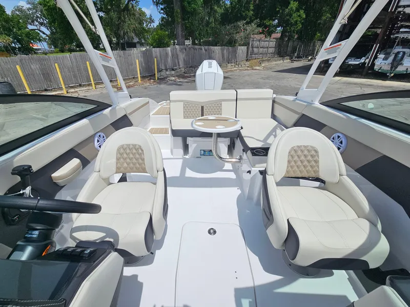 Slide: The Image of 2025 Monterey M-225 boat interior with plush seating and modern design. - 16