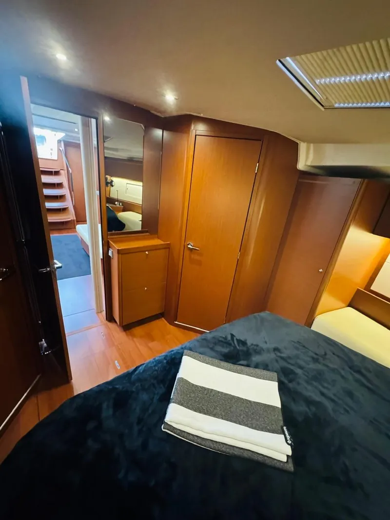 Slide: The Image of Luxurious interior of 2020 Beneteau Oceanis 51.1 yacht with cozy cabin and wooden finishes. - 12