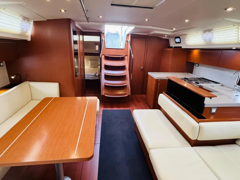 Slide: The Image of Luxurious interior of 2020 Beneteau Oceanis 51.1 yacht with modern kitchen and seating area. - 17