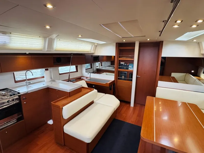 Slide: The Image of Luxurious interior of 2020 Beneteau Oceanis 51.1 yacht with modern kitchen and seating area. - 21