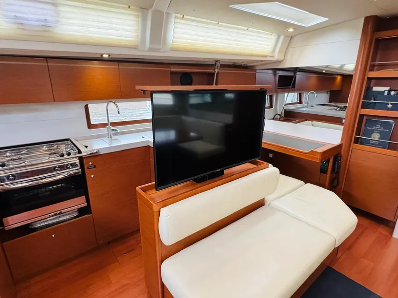 Slide: The Image of Luxurious interior of 2020 Beneteau Oceanis 51.1 yacht with modern kitchen and seating area. - 22