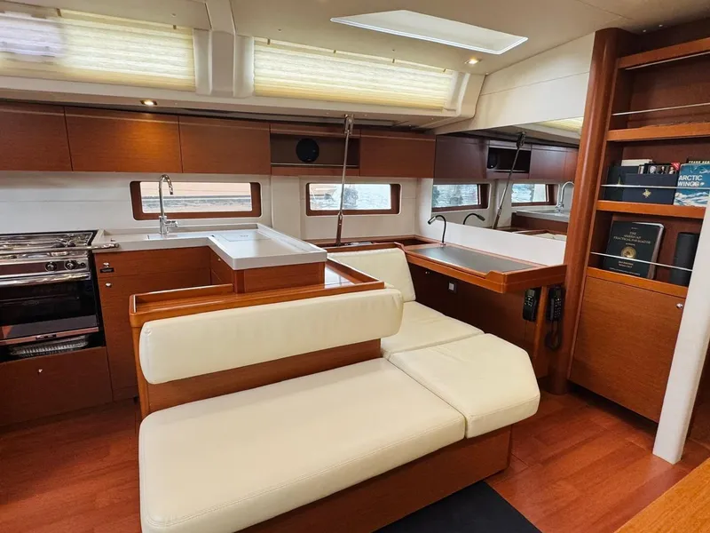 Slide: The Image of Luxurious interior of 2020 Beneteau Oceanis 51.1 yacht with modern kitchen and seating area. - 24