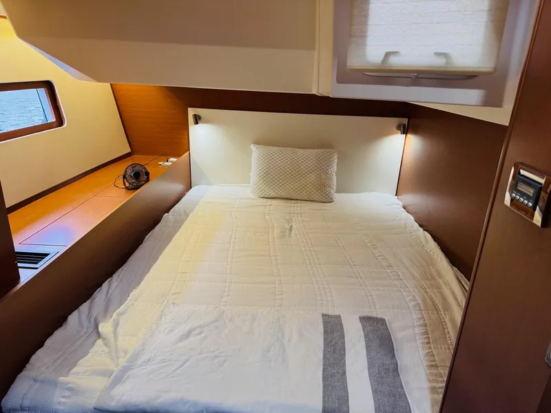 Slide: The Image of Cozy cabin interior of 2020 Beneteau Oceanis 51.1 yacht with comfortable bed and modern design. - 42