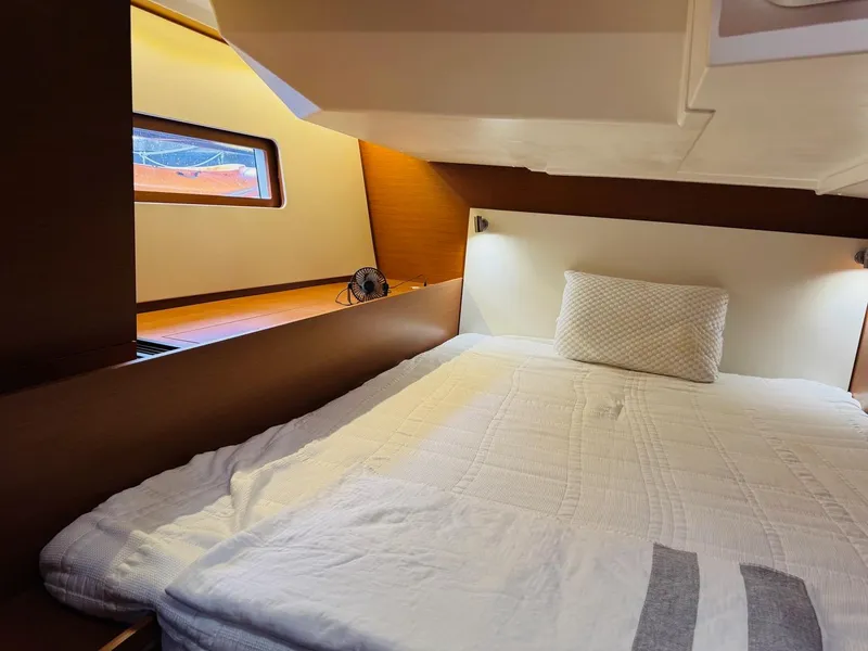 Slide: The Image of Cozy cabin interior of 2020 Beneteau Oceanis 51.1 yacht with comfortable bedding. - 43
