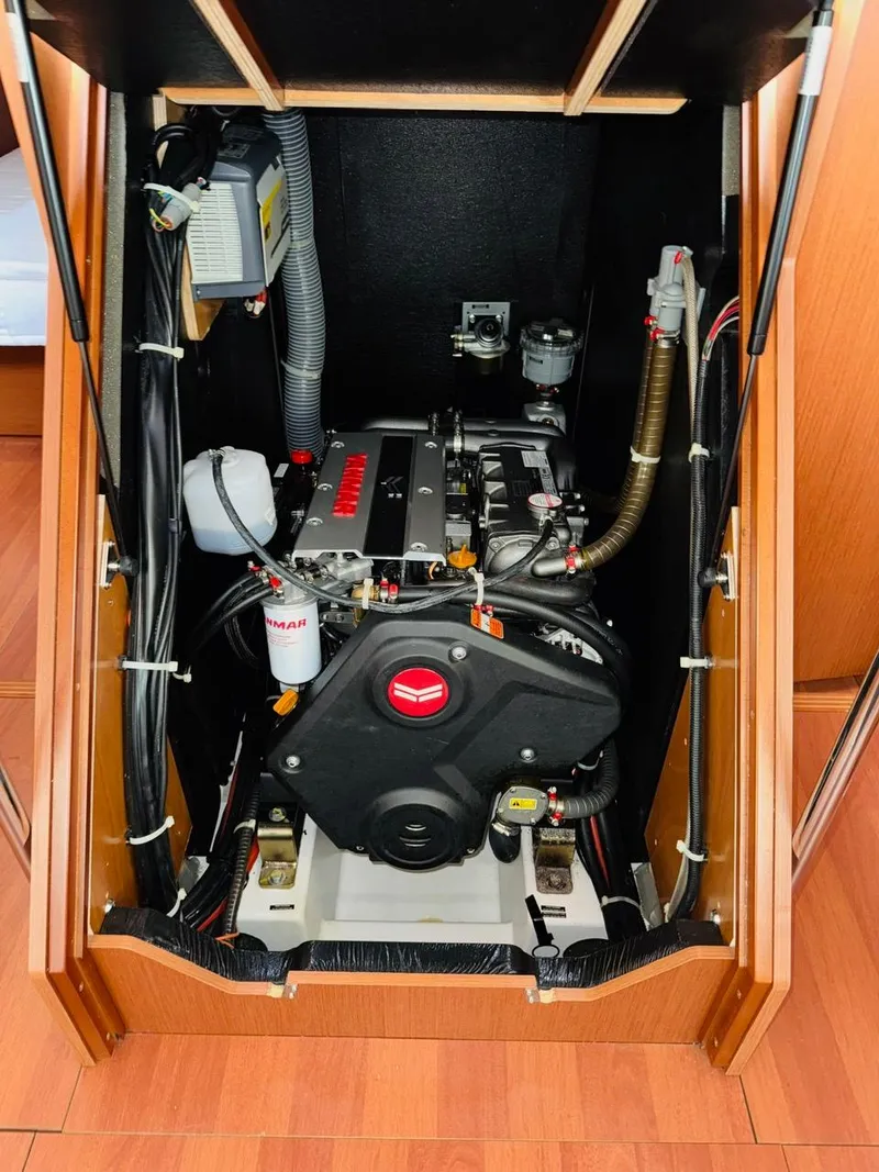 Slide: The Image of Engine compartment of a 2020 Beneteau Oceanis 51.1 sailboat, showcasing mechanical components. - 48