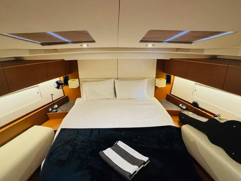 Slide: The Image of Luxurious cabin interior of 2020 Beneteau Oceanis 51.1 yacht with cozy bedding. - 8