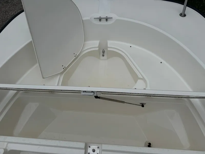 Slide: The Image of 2013 Boston Whaler 210 Montauk boat storage compartment, open and empty. - 13
