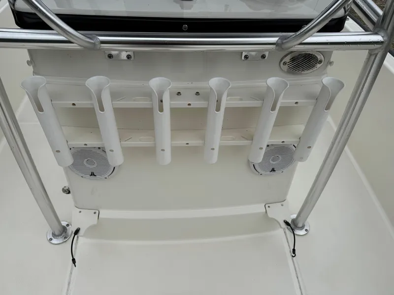 Slide: The Image of 2013 Boston Whaler 210 Montauk boat console with rod holders and speakers. - 16