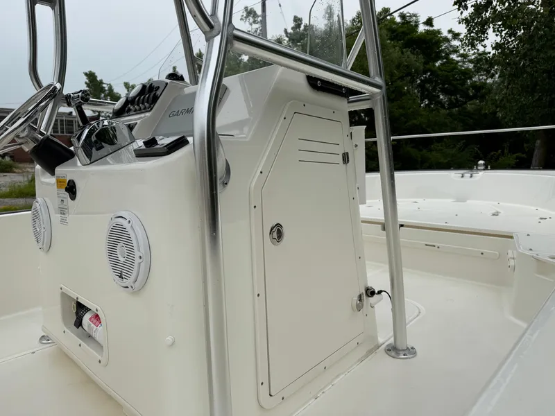 Slide: The Image of 2013 Boston Whaler 210 Montauk boat console with steering wheel and electronics. - 17