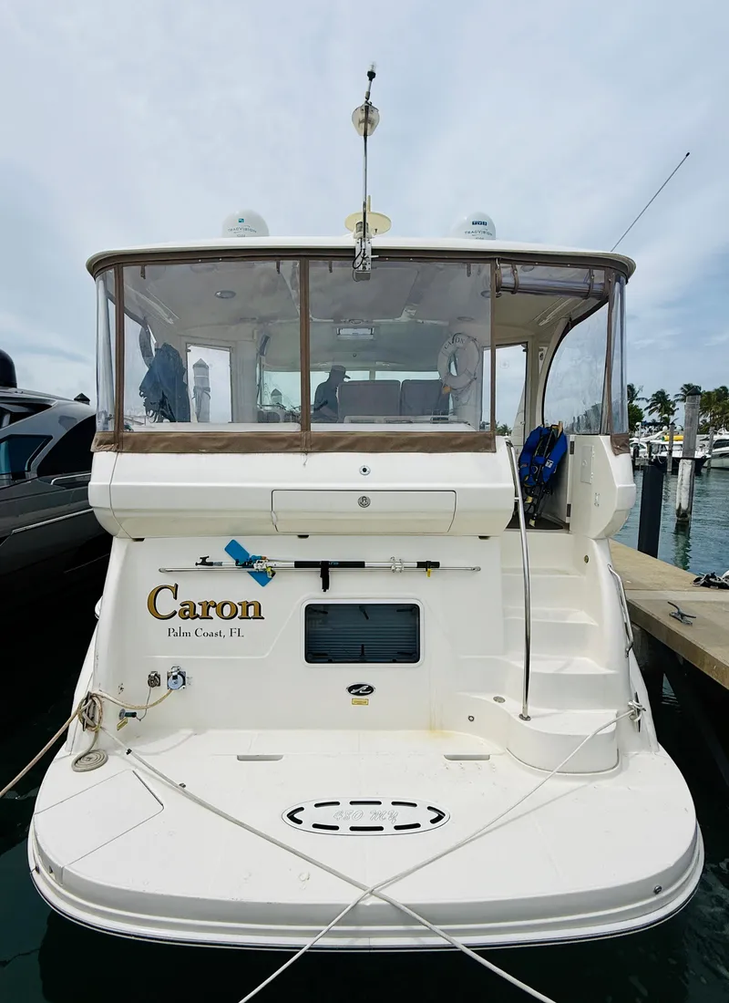 Slide: The Image of 2003 Sea Ray 480 Motor Yacht docked at marina, rear view. - 12