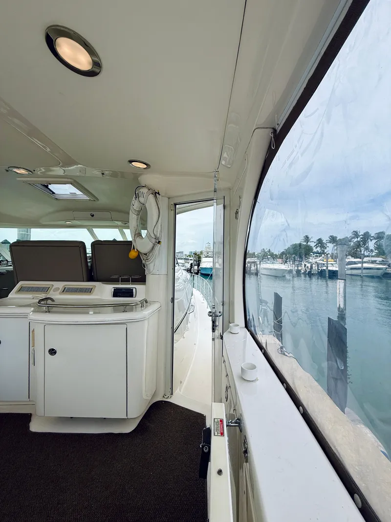 Slide: The Image of Interior view of 2003 Sea Ray 480 Motor Yacht with marina backdrop. - 16