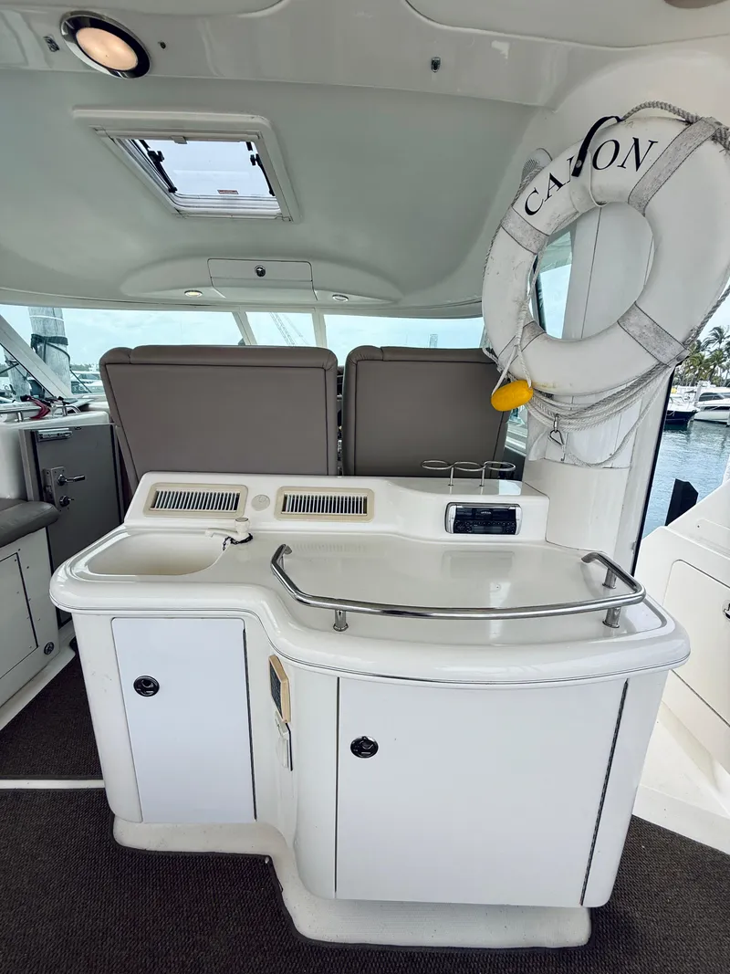 Slide: The Image of 2003 Sea Ray 480 Motor Yacht interior with sink, counter, and life preserver. - 21