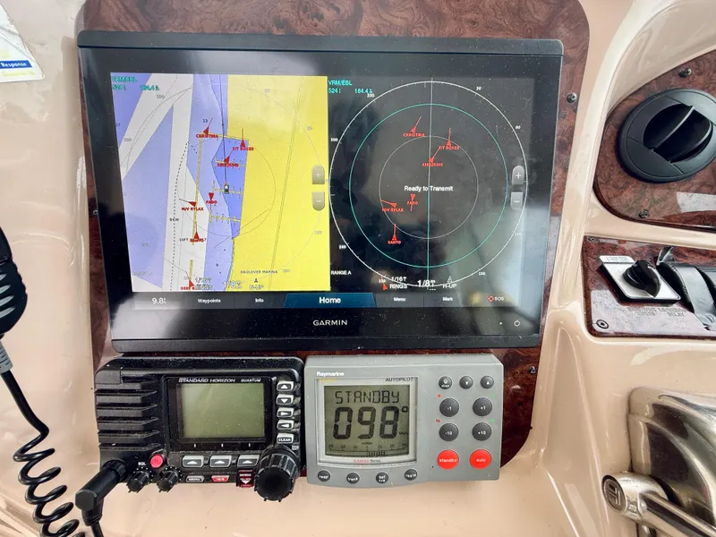 Slide: The Image of Garmin navigation system on 2003 Sea Ray 480 Motor Yacht dashboard with radar and communication devices. - 29