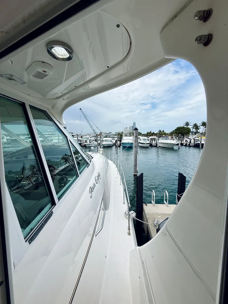 Slide: The Image of 2003 Sea Ray 480 Motor Yacht docked at marina with clear sky. - 33