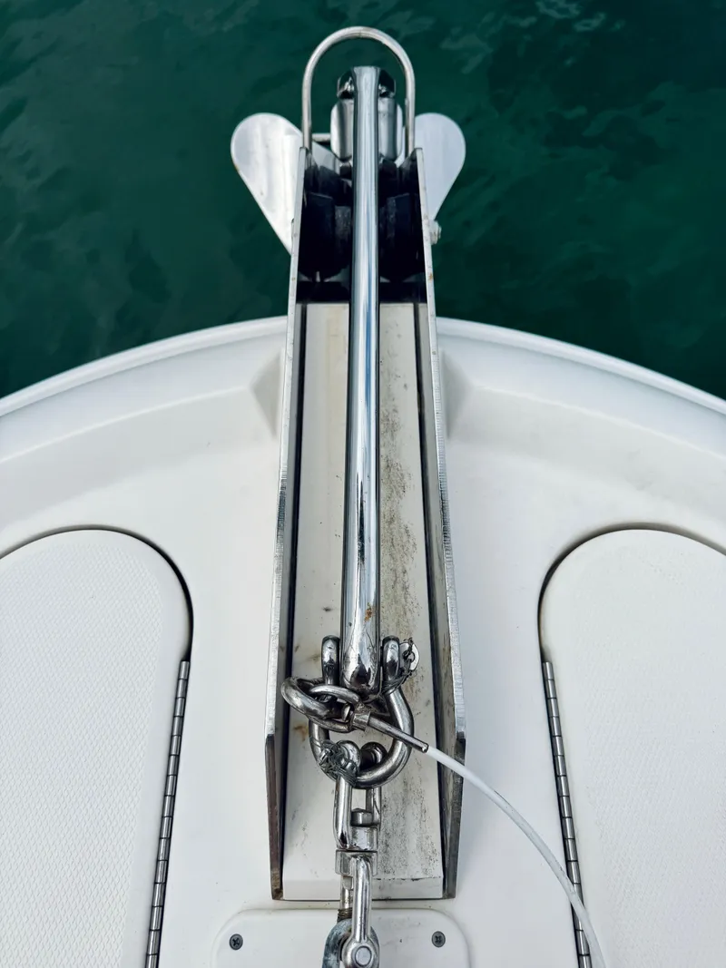 Slide: The Image of Bow anchor of 2003 Sea Ray 480 Motor Yacht on calm water. - 36