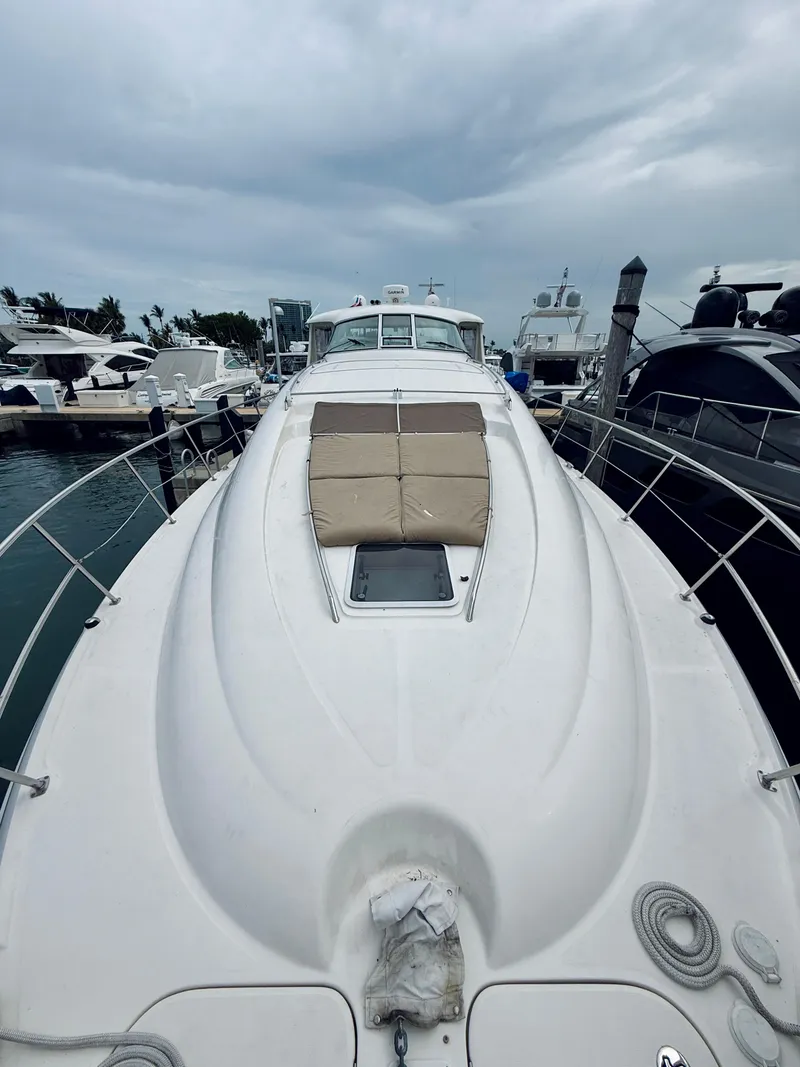 Slide: The Image of 2003 Sea Ray 480 Motor Yacht docked at marina under cloudy sky. - 37