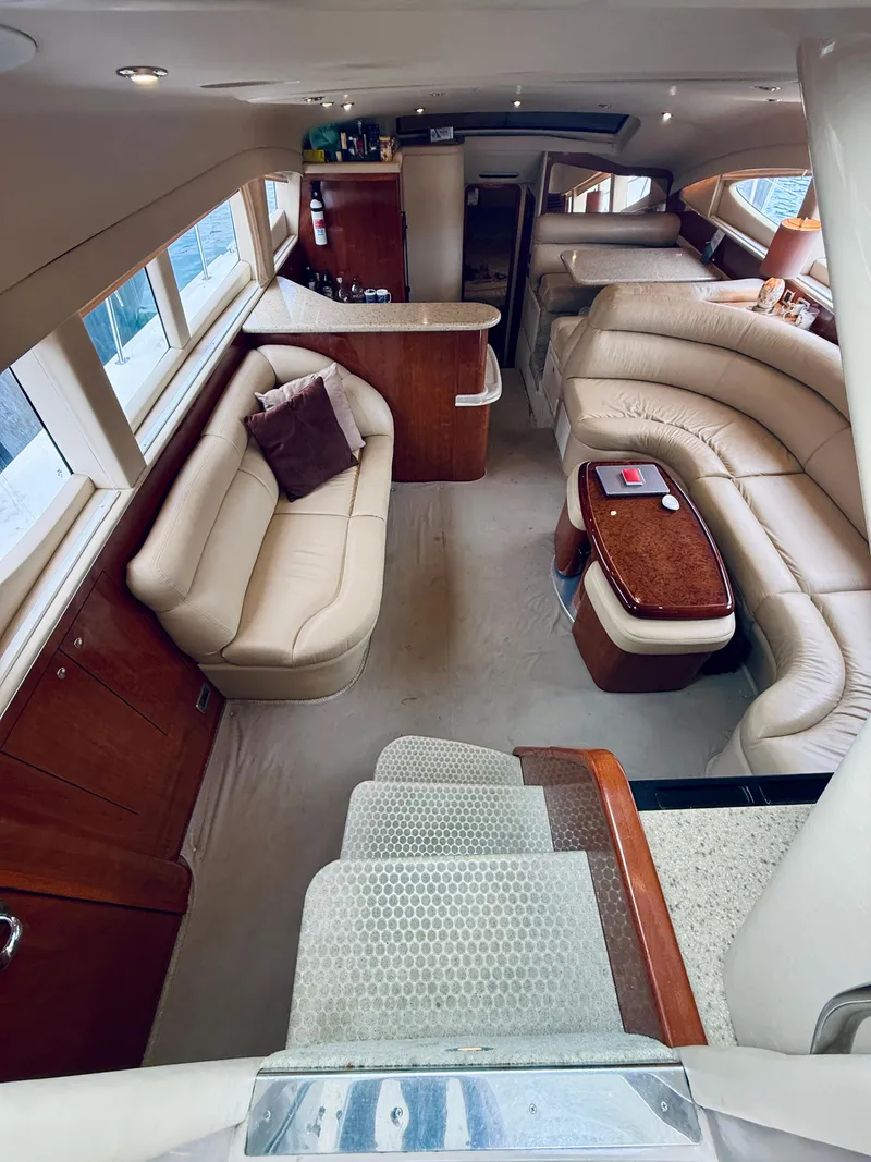 Slide: The Image of Luxurious interior of 2003 Sea Ray 480 Motor Yacht with plush seating and elegant wood finishes. - 39
