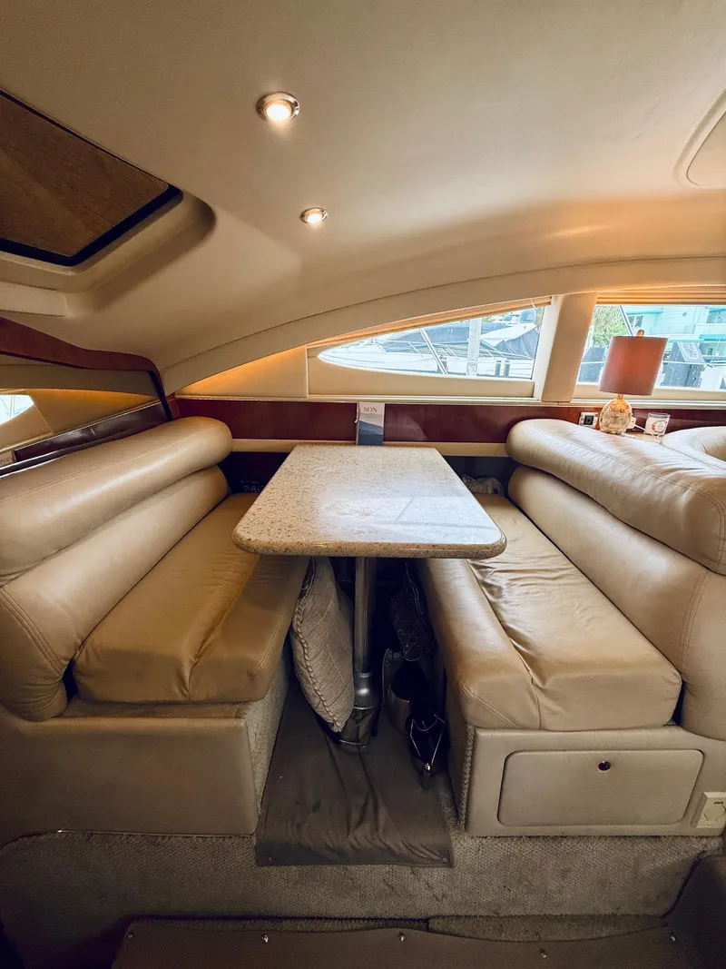 Slide: The Image of Luxurious interior of 2003 Sea Ray 480 Motor Yacht with plush seating and elegant table. - 47