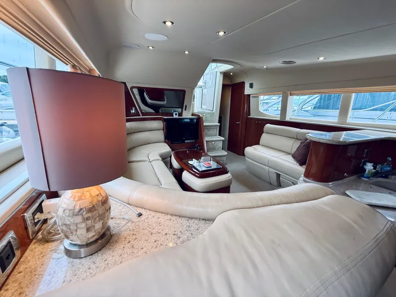 Slide: The Image of Luxurious interior of a 2003 Sea Ray 480 Motor Yacht with elegant seating and decor. - 49