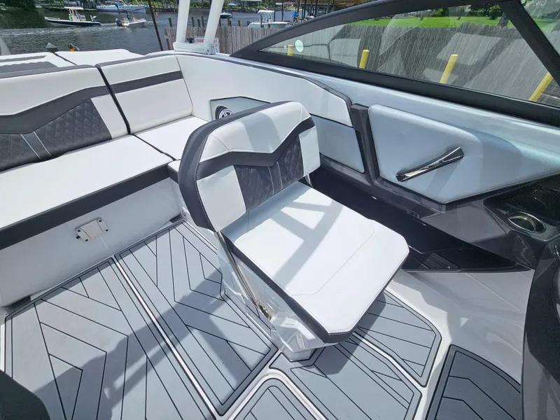 Slide: The Image of 2025 Monterey 235SS boat interior with modern seating and sleek design. - 14