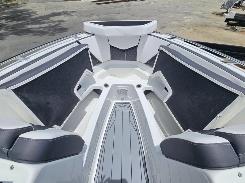 Slide: The Image of 2025 Monterey 235SS boat interior with sleek seating and modern design. - 19