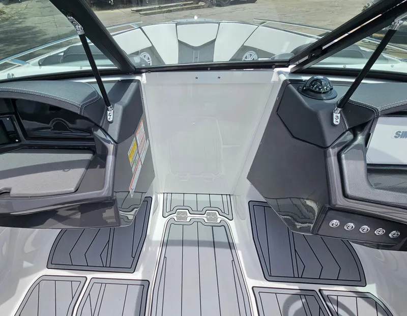 Slide: The Image of 2025 Monterey 235SS boat interior with sleek design and modern dashboard controls. - 24