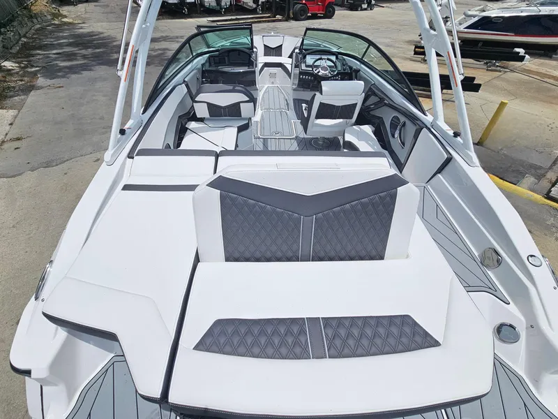 Slide: The Image of 2025 Monterey 235SS boat interior with modern seating and sleek design. - 8