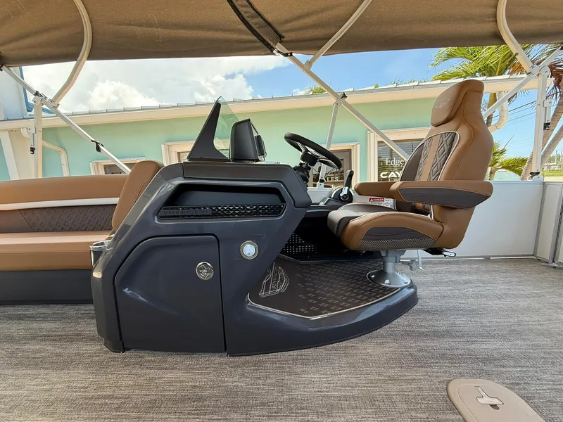 Slide: The Image of 2026 Bennington 24 MSB boat interior with captain's chair and control console. - 10